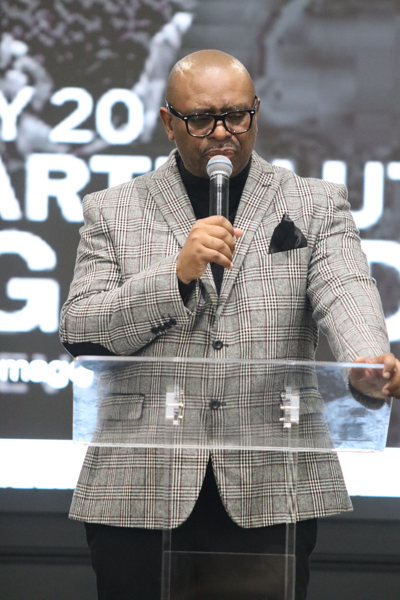 Pastor Myron Barfield preaching from the pulpit